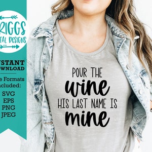 May include: A gray t-shirt with the text "POUR THE wine HIS LAST NAME IS mine" in black cursive lettering.