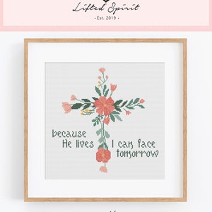 May include: Cross stitch pattern featuring a floral cross with the text "because He lives I can face tomorrow". The pattern is in shades of pink, green, and white.