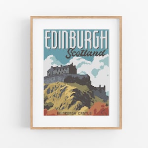 May include: A framed print featuring a pixelated illustration of Edinburgh Castle in Scotland. The artwork displays the text "EDINBURGH Scotland" in a retro font, with the castle atop a yellow and brown hill, under a blue sky.