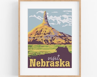 May include: A vintage-style travel poster with a pixelated image of a mountain with a tall rock formation. The text "visit Nebraska" is at the bottom of the poster.
