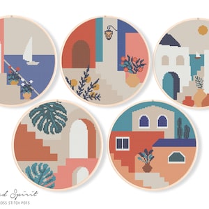 May include: Set of five cross stitch patterns featuring colorful geometric designs of buildings, plants, and stairs. The patterns are inspired by Mediterranean architecture and feature a variety of colors, including blue, green, orange, and pink.