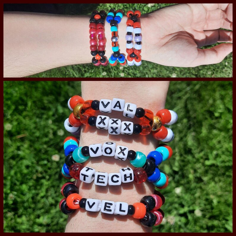 Peut inclure: Plusieurs bracelets de perles color&eacute;es. Les bracelets pr&eacute;sentent diverses couleurs, notamment le rouge, le noir, le blanc, le bleu et l'orange. Certains bracelets comportent des perles lettr&eacute;es &eacute;pelant des mots. Les bracelets sont port&eacute;s au poignet.