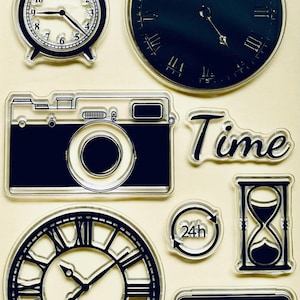 May include: A collection of black and white time-themed images, including a clock, a camera, and the word "Time". Other images include an hourglass, a digital clock, and a 24-hour symbol.