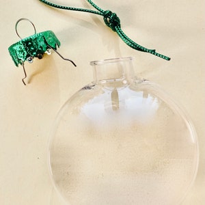 1 Large Empty Hard Plastic Round ORNAMENT for filling String Ornament and top Fillable 4 Inch Wide 1 inch Thick