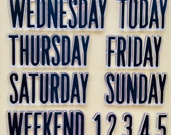 May include: Clear acrylic stamps with black lettering for days of the week, numbers, and abbreviations for street names. The stamps include: Monday, Tuesday, Wednesday, Thursday, Friday, Saturday, Sunday, Today, Weekend, 1, 2, 3, 4, 5, 6, 7, 8, 9, 0, ND, RD, TH, and ST.
