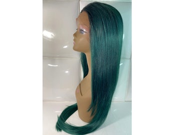 May include: A long, straight, dark green wig on a mannequin head. The wig is styled with a center part and falls to the shoulders.