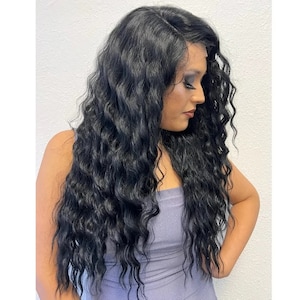 May include: A long, black, wavy wig with a lace front. The wig is styled in loose waves and falls to the shoulders.
