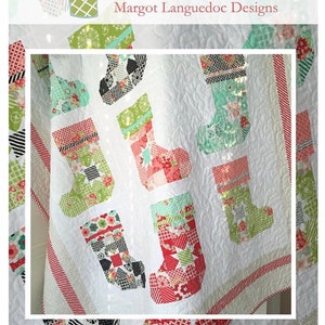 May include: A Christmas-themed quilt featuring patchwork stockings in various patterns and colors, including red, green, and black, set against a white background. The quilt has a quilted texture and is bordered with red and white stripes. The text "Ready for Santa" is visible.