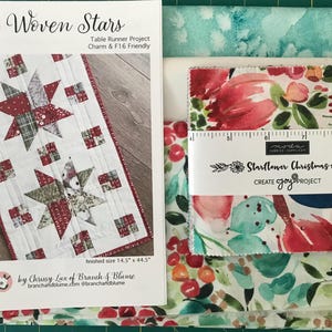 May include: A table runner quilting pattern featuring a woven star design with red, green, and white fabric. The pattern is called "Woven Stars" and is a table runner project that is Charm & F16 friendly. The finished size is 14.5 inches by 44.5 inches. The pattern is by Chrissy Lux of Branch & Blume.