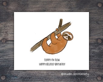 May include: A brown sloth hangs upside down from a branch with the text "Sorry I'm slow. Happy Belated Birthday!" and the signature "@studio_spontaneity".