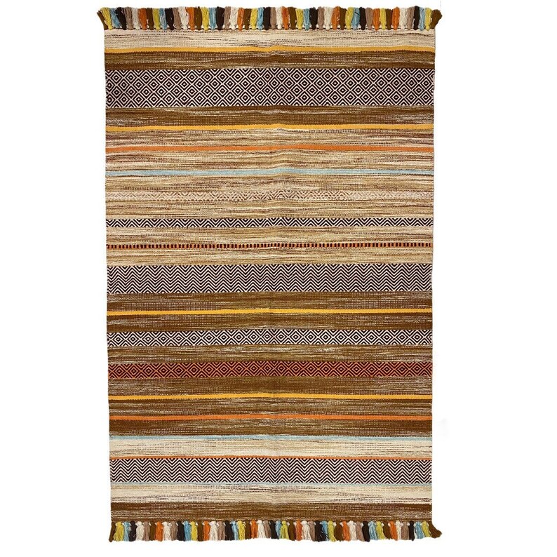 May include: A brown and beige striped rug with colorful fringe. The rug has a geometric pattern with a variety of colors, including red, orange, yellow, blue, and green.