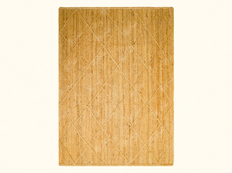 May include: A natural fiber rug with a diamond pattern in a light brown color.