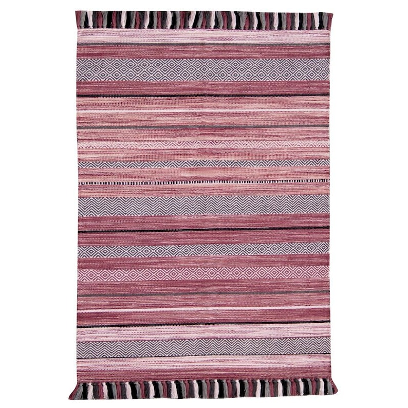 May include: A rectangular rug with a striped pattern in shades of red, pink, and gray. The design includes horizontal stripes, diamond patterns, and fringe detailing on the top and bottom edges. This rug is suitable for home decor.