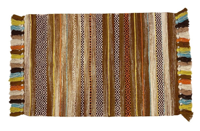 May include: A brown, beige, and blue striped rug with fringe on the ends. The rug has a geometric pattern.