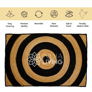 May include: A black and natural jute rug with a concentric circle pattern. The rug has the text "INDIA LIVING" in the center.