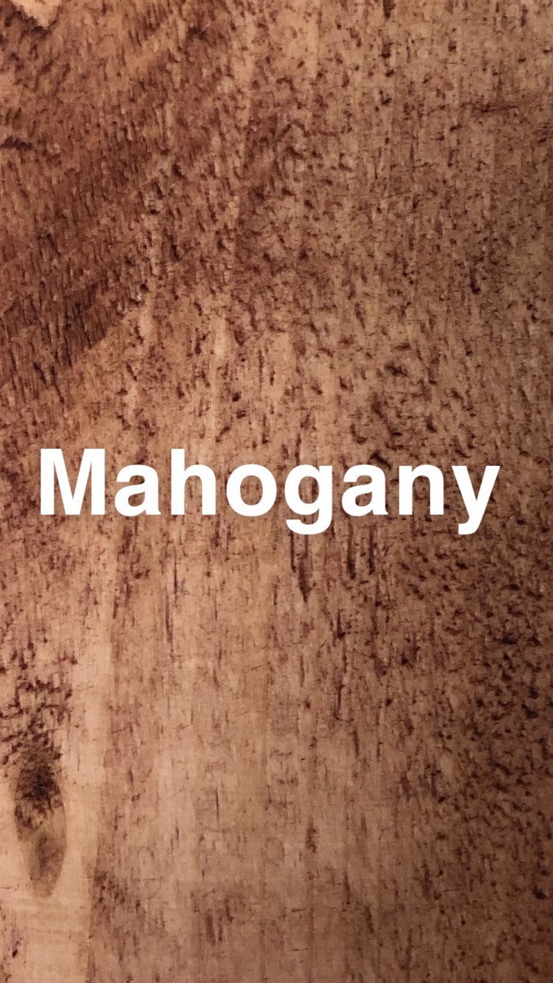 May include: Close-up of a wood grain texture in a mahogany color.