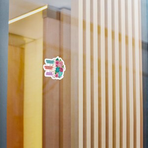 May include: A sticker with a floral design and the words "Frontal Lobe", "Ventral Medial", and "Occipital Lobe" in different colors.