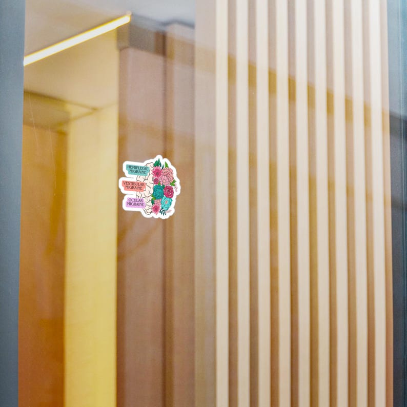 May include: A sticker with a floral design and the words "Frontal Lobe", "Ventral Medial", and "Occipital Lobe" in different colors.