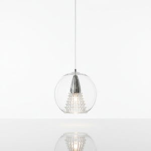 May include: A modern pendant light with a clear glass globe and a silver-colored, cone-shaped center. The light hangs from a thin white cord against a white background. The design features a textured, crystal-like element within the glass sphere.
