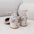 Pinky White Bridal Sandals with Handmade Embroidery, Wedding Shoes with V-Cut Vamp, Almond Toe and Ankle Strap, Bridal Shoes Low Block Heel product logo