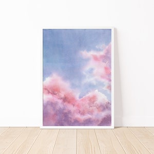 Puede incluir: Pintura acuarela de un cielo nublado rosa y morado. Las nubes son suaves y esponjosas, y el cielo es azul claro.