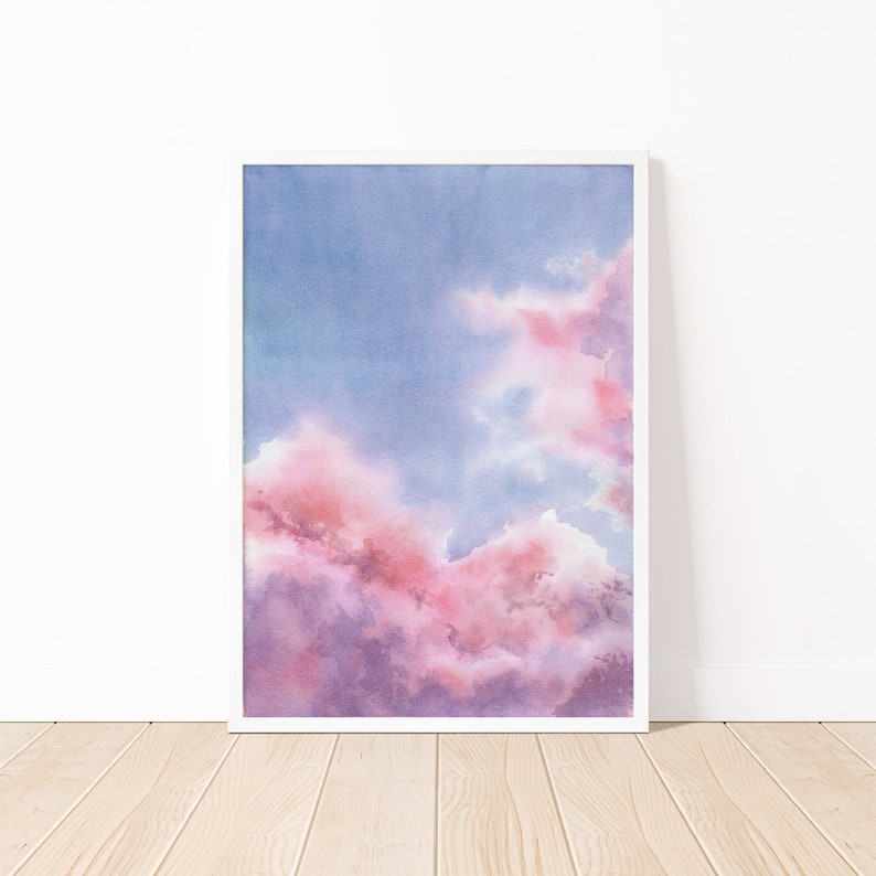 Puede incluir: Pintura acuarela de un cielo nublado rosa y morado. Las nubes son suaves y esponjosas, y el cielo es azul claro.