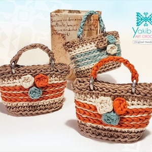 Embroidered amigurumi bag with handles and colored flowers