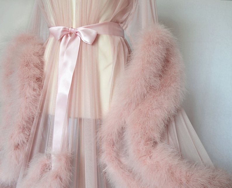 pink robe with feathers