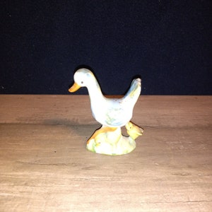Vintage antique Goose with baby figurine