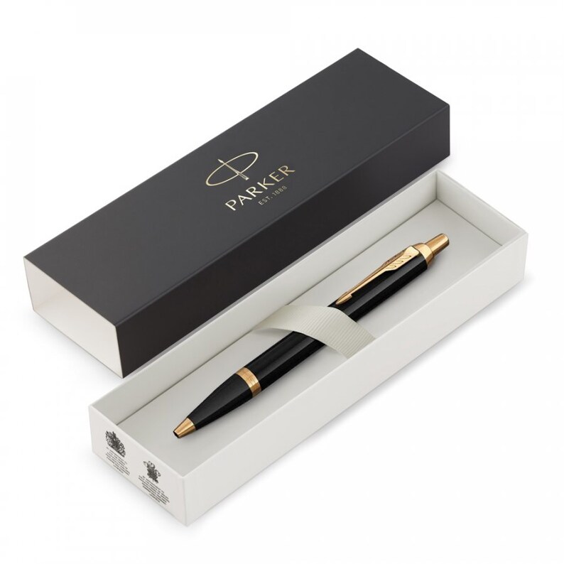 May include: A black and gold Parker pen in its box. The box is black with the Parker logo and the words "Est. 1888".