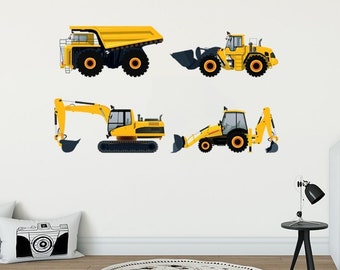 May include: A white wall with four yellow construction vehicles, including a dump truck, a front loader, and two excavators. The vehicles are arranged in a row, with the dump truck at the top and the excavators at the bottom. The wall is decorated with a white bed frame with a white headboard and a white pillow with a brown owl design.