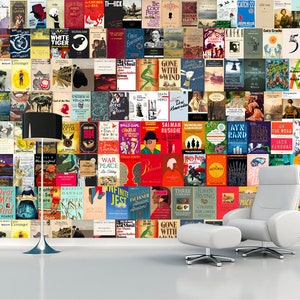 May include: A wall covered in colorful book covers, featuring titles like "Catch-22", "The Color Purple", "Gone With the Wind", "War and Peace", and "The Lord of the Rings". There are two white chairs with a white ottoman in front of the wall.