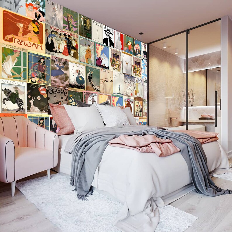 May include: A bedroom with a white bed, a pink armchair, and a wall covered in vintage Vogue magazine covers. The wall is a collage of different covers, each with a unique design and illustration.