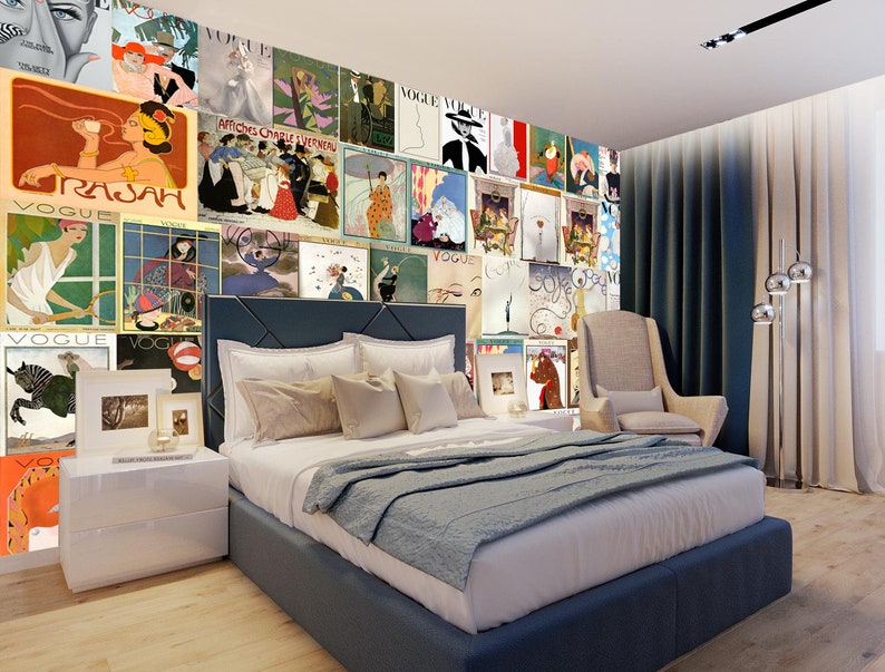 May include: A bedroom interior with a blue headboard bed and a beige armchair. The wall is covered with a collage of vintage Vogue magazine covers featuring women in various poses and clothing.