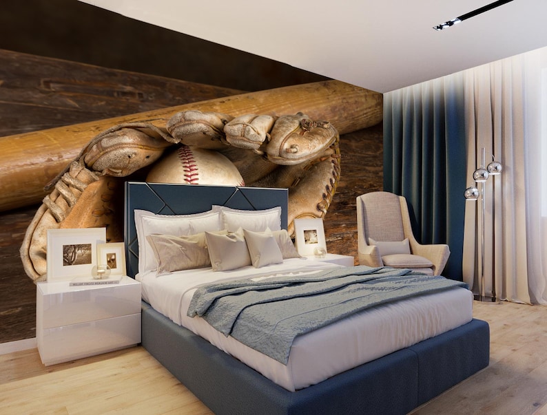 May include: A baseball, baseball bat and catcher's mitt are displayed against a wood background. The baseball is in the mitt, and the bat is resting on top of the mitt. The background is a bedroom with a bed, bedside table and chair.
