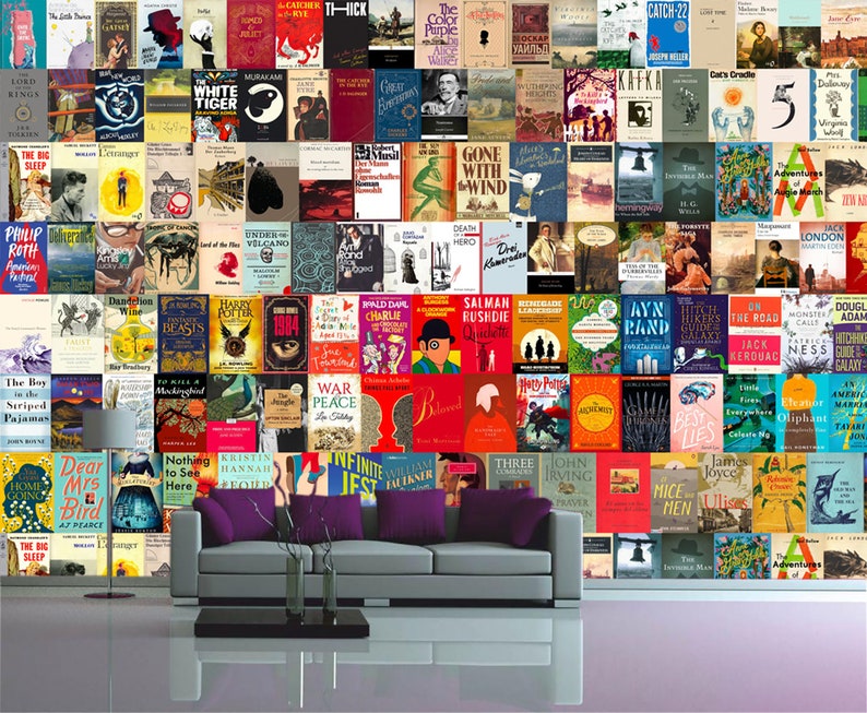 May include: A wall covered in book covers, featuring a variety of titles and authors. A gray couch with purple pillows sits in front of the wall.