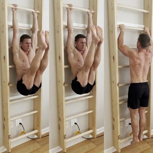 May include: A light-colored wooden wall-mounted stall bar exercise unit featuring multiple horizontal rungs. The structure is constructed from vertical side rails and evenly spaced wooden bars, designed for various fitness movements.
