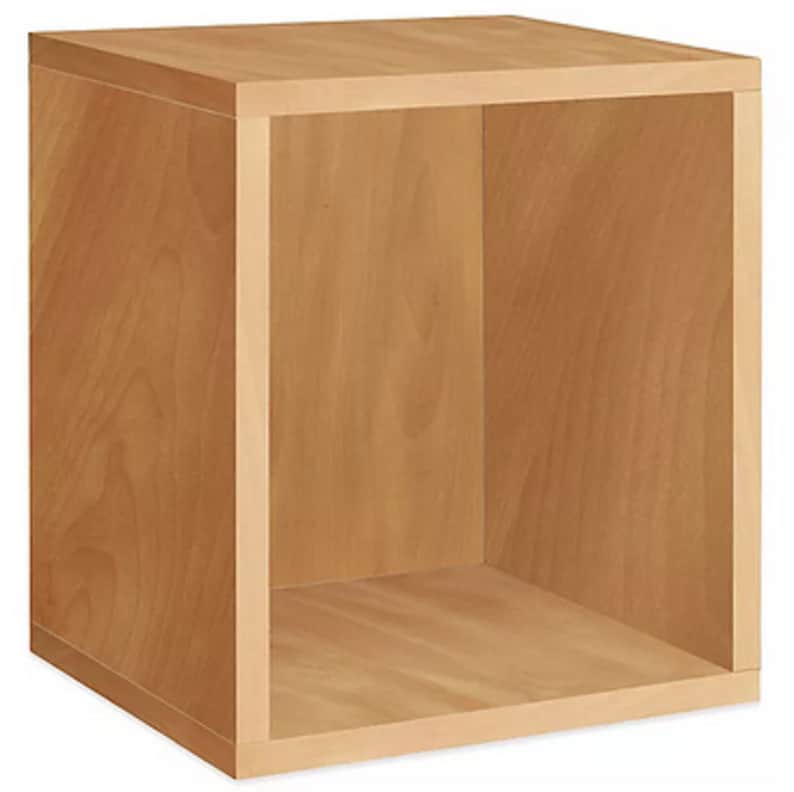 May include: A light brown wooden cube-shaped storage unit with an open front. The unit is made of light-colored wood with visible grain. The cube is designed for storage and display purposes.