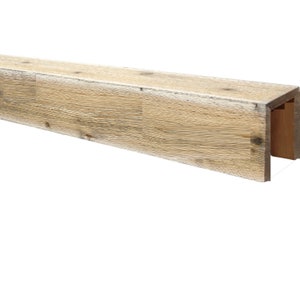 May include: A light brown faux wood beam with a rustic finish. The beam has a U-shaped channel on the back for easy installation.