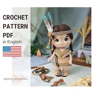 May include: A crocheted doll in Native American attire, with a tan dress and colourful accents, a feathered headdress, and braided hair. The image includes text that reads "CROCHET PATTERN PDF in English" and the American flag.