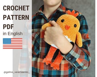 May include: A crochet pattern PDF in English for making a cute orange and white chick amigurumi toy. The pattern includes instructions for crocheting the chick's body, legs, beak, and eyes.