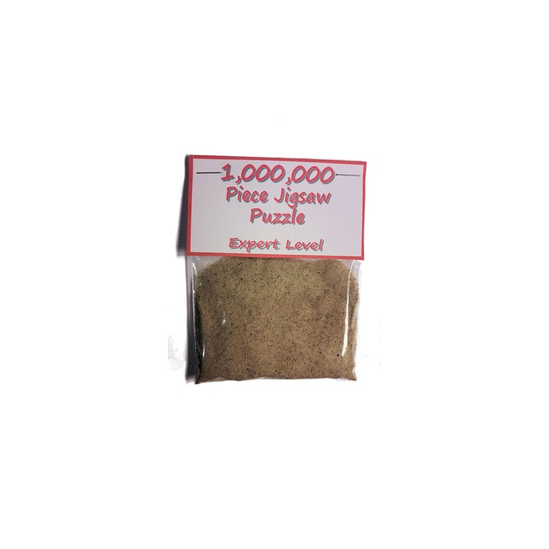 May include: A clear plastic bag filled with a pile of light brown puzzle pieces. A white label with red borders is attached to the bag, displaying the text "1,000,000 Piece Jigsaw Puzzle" and "Expert Level".