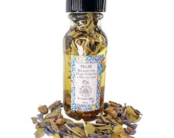 May include: A small glass bottle with a black cap filled with a yellow oil and herbs. The label reads "No.35 Blessing for Good Fortune + Protection Oil" and "New Moon Oils 15ml".