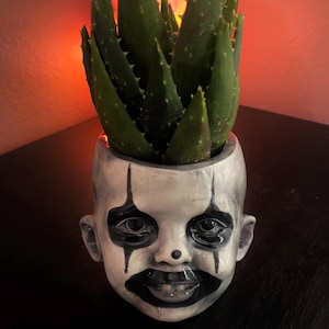 Scary clown child ceramic planter
