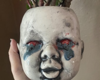 Larger molten tears baby head planter