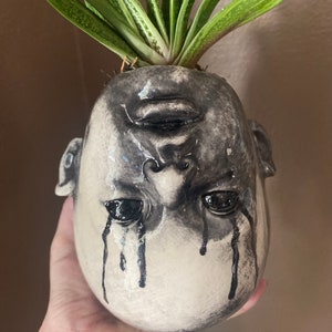 Creepy crying upside down doll head succulents planter