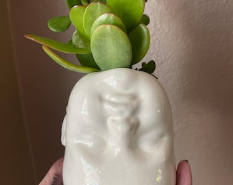 White upside down baby head  planter