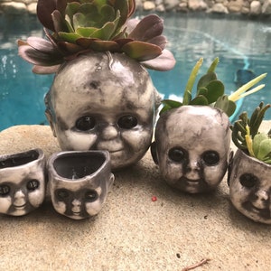 Creepy Kewpie head  flower pot