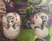 Bloody upside down baby head planter