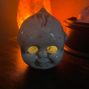 Kewpie head votive candle holder
